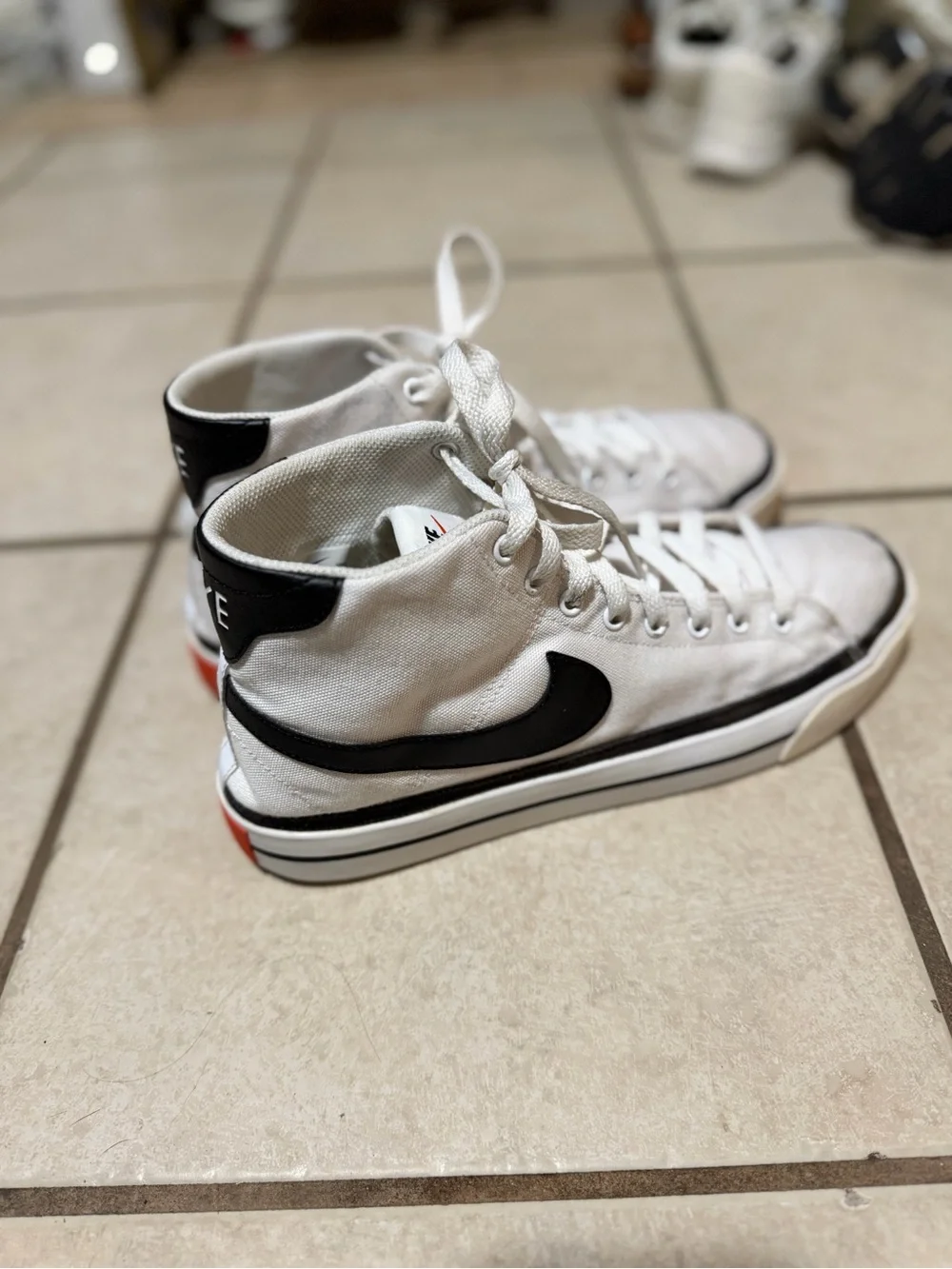 Nike Men’s White Canvas Mid-Top Sneakers with Black Swoosh and Trim